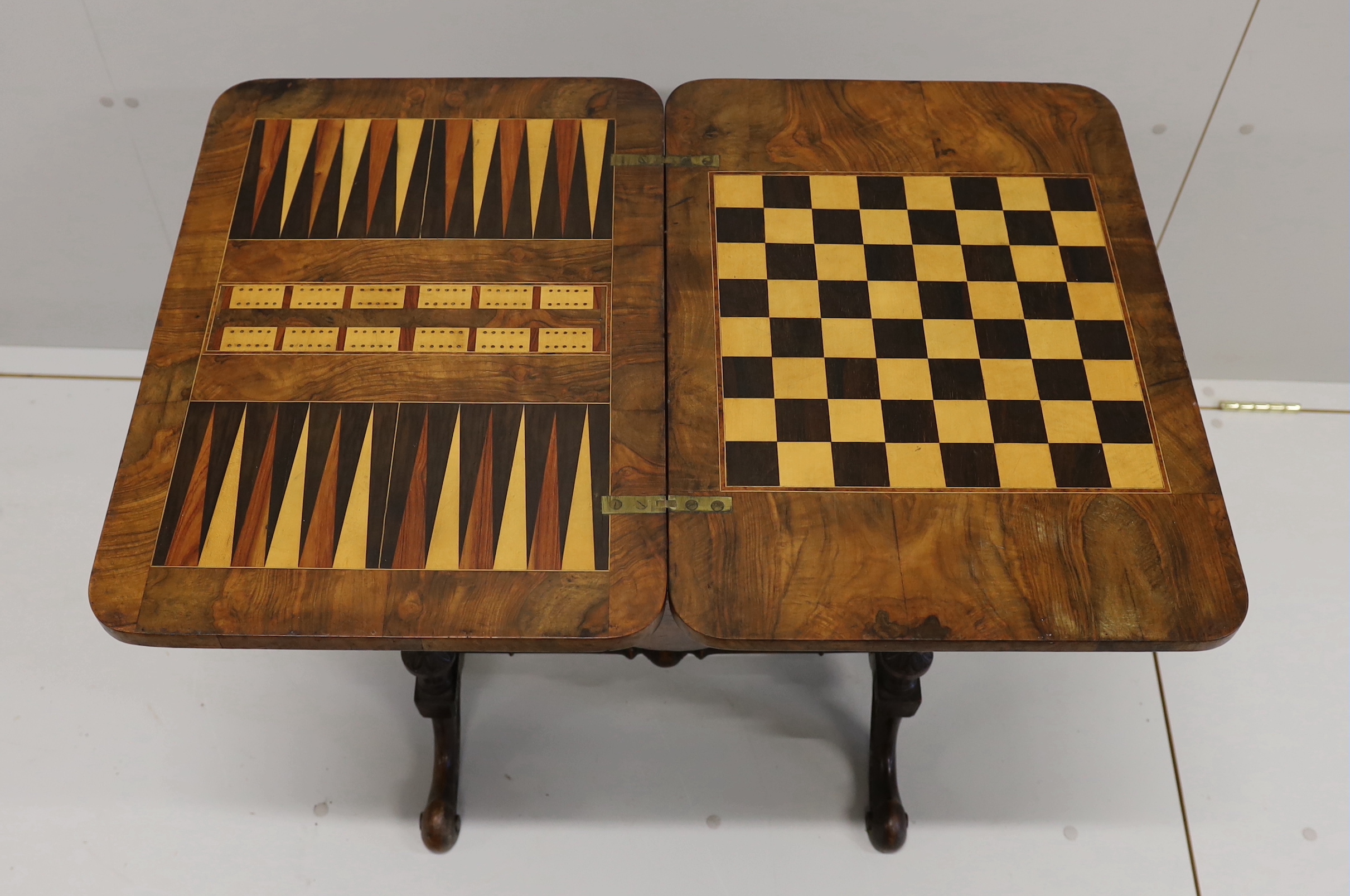 A Victorian figured walnut rectangular sewing / games table, width 58cm, depth 41cm, height 69cm